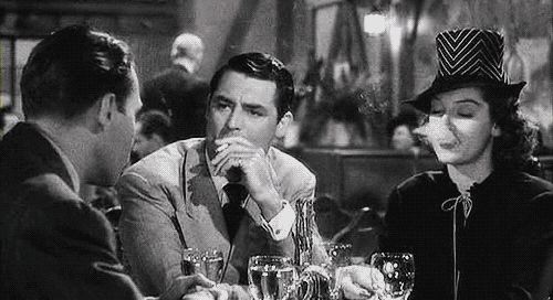 His Girl Friday Walter and Hildy puffing cigarette smokes in front of Bruce